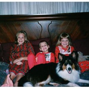 November or December 1997.  Jasmine was almost a year old. We were trying to take a Christmas picture but she felt left out. I'm on the left, 8 or 9 y