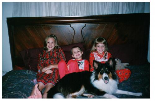 November or December 1997.  Jasmine was almost a year old. We were trying to take a Christmas picture but she felt left out. I'm on the left, 8 or 9 y