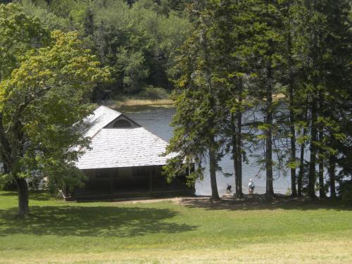 The boathouse with a doggie beach by the pond.  There must have been at least 10 dogs here enjoying the water!